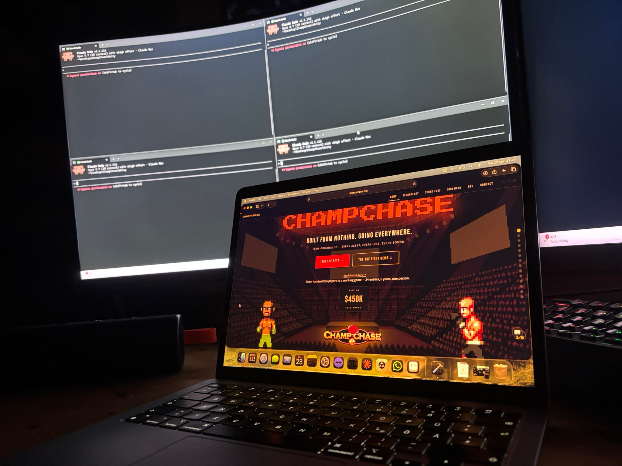 Mac Air M1 on the desk. ChampChase site on the screen. Terminals running in the background.